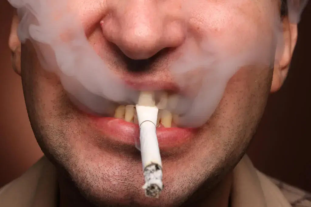 a Man Smoking a Cigeratte