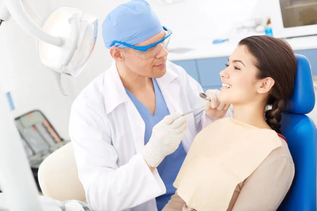 patient with dentist fixing clear aligners auburn